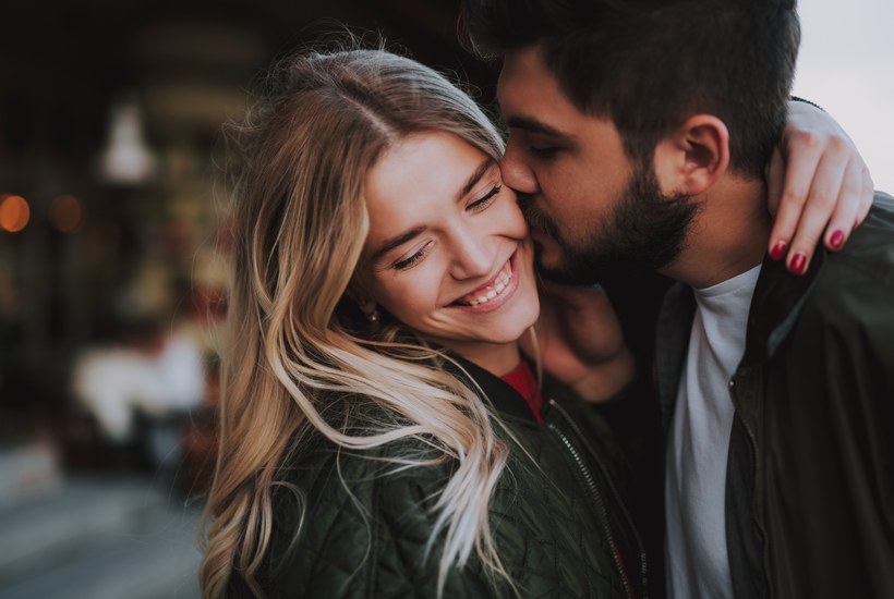 Young Romantic Couple Holding Present