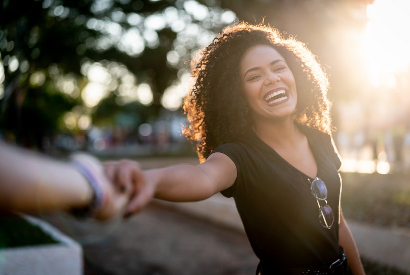 Beautiful Curly Hair Woman Holding Hands Following Boyfriend 