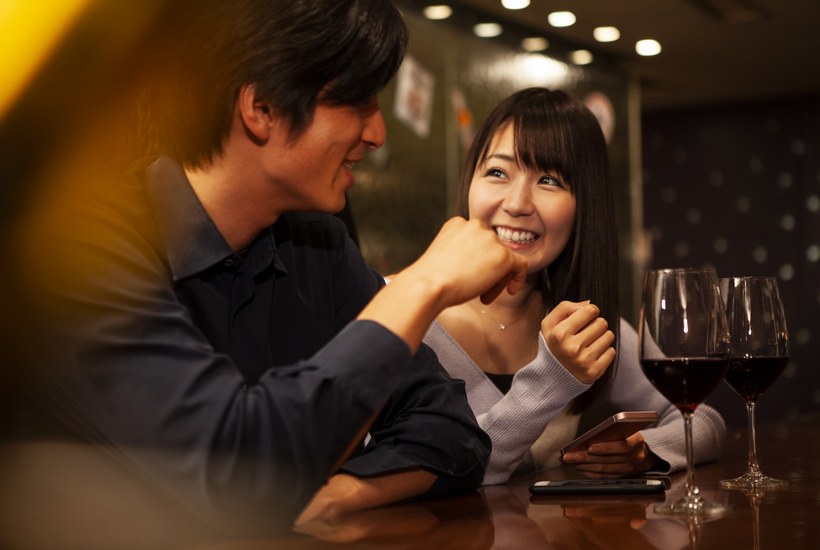 Enjoying Conversation In Restaurant