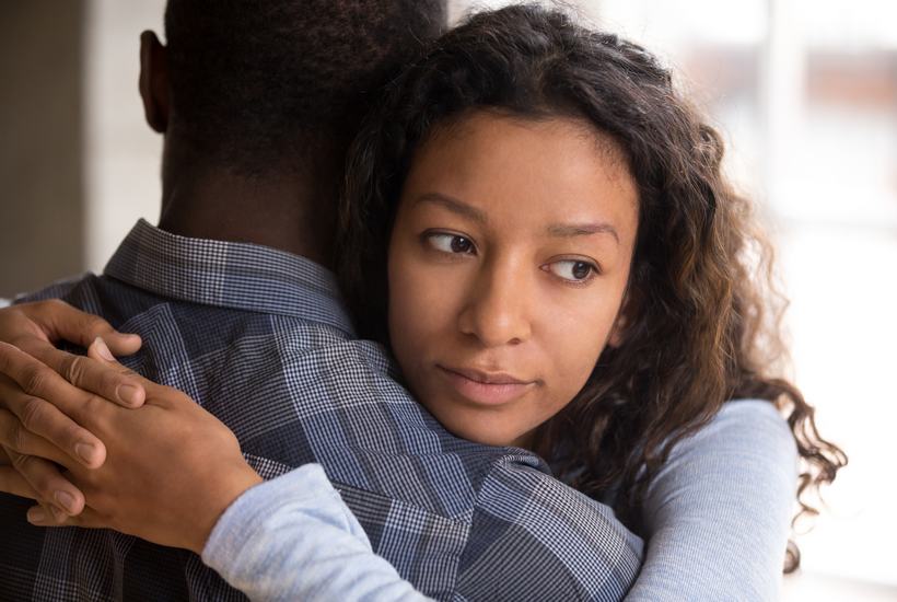 Thoughtful Young Woman Hug Boyfriend Thinking Of Relationships